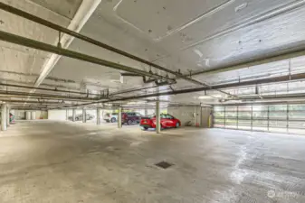 The secure garage includes two parking spaces and a private and large storage room.