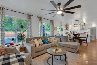 Open concept flow between the family room and the kitchen with direct access to the deck.