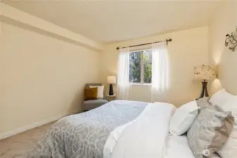 The fresh paint continues for a serene bedroom.