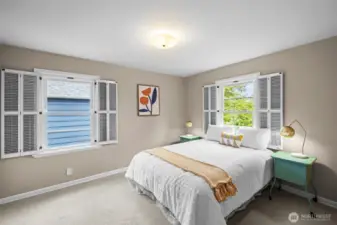 Spacious bedroom, wood shutters