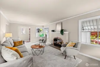 A wonderfully spacious living room with GAS fireplace and corner windows