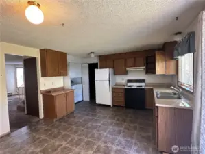Note the laundry in the corner and the door to the garage for direct access.