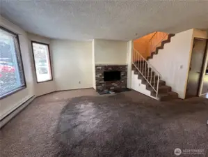 Wood burning fireplace. This will be so sweet with new paint, flooring and fixing up.