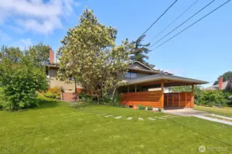 Private entrance, lush lawn and a carport that is aesthetically pleasing!
