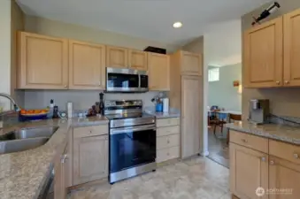 Kitchen with new and/or newer stainless steel appliances and granite countertops.