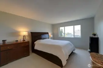 Primary bedroom has views of the Olympic Mountains.