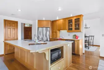 Kitchen has a walk in pantry and plenty of cabinets, large island, with counter height seating.