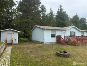Utility shed, firepit and raised septic.