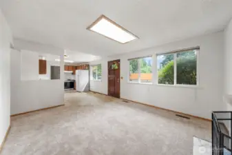 Open concept between living, dining, and kitchen spaces.