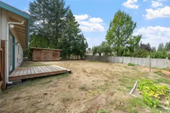 Huge backyard with deck.