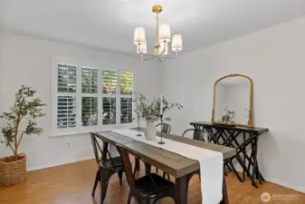 Formal dining room, also with plantation shutters.