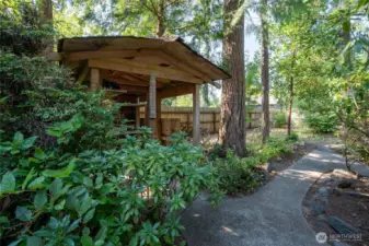 Small shed for potting or yard supplies.