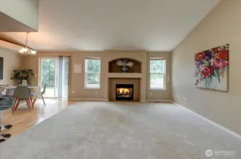 Living room with vaulted ceilings and fireplace