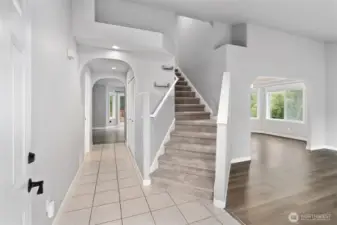 Grand entryway that leads to the formal living room and stairs to the upstairs bedrooms.