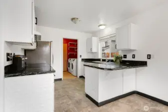 Entrance to the laundry room through the kitchen.