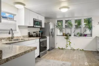 A light and bright kitchen comes with all appliances.