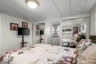 The primary bedroom has access to a deck and the backyard.