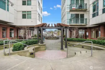 Level pedestrian entry off 106th Pl NE with lovely courtyard.