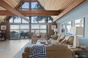 Great room with open beams, wood lined ceilings, new upper windows.  What a view.  Dining area to left.  Furniture may be available for purchase.