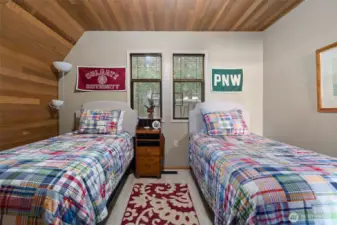 Smaller main level bedroom w cedar-lined wall and ceiling