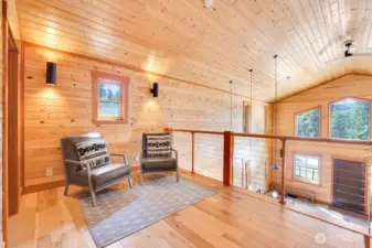 The primary bedroom w en suite is in the lofted 2nd floor. It features a vaulted ceilings, large sitting area, and a 3/4 bath.