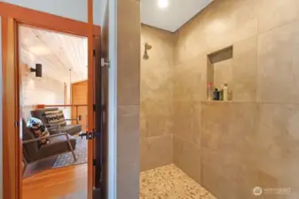 The primary bedroom w en suite is in the lofted 2nd floor. It features a vaulted ceilings, large sitting area, and a 3/4 bath.