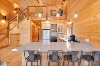 This property boasts rich wood finishes, soaring ceilings, and open-concept design.
