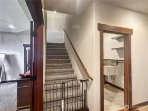 Off the primary suite is the stairs to the bonus room, laundry and garage access.