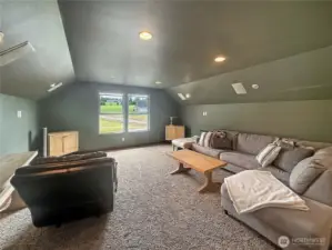 Upstairs media room with projector and screen.