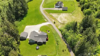 Experience the best of both worlds: a private, tree-lined sanctuary just a short drive from shops, dining, and schools.  virtually enhanced grass