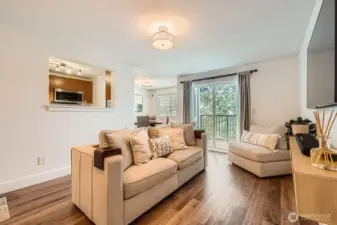 Beautiful newer hardwood floors, open and airy, with a slider to a private deck.