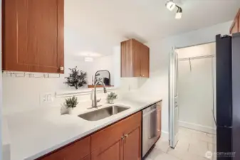 Upgraded kitchen with top of the line appliances, stone countertops, and stainless steel faucet.