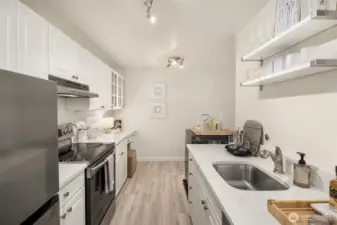 Quartz counters, tons of storage and Stainless Appliances