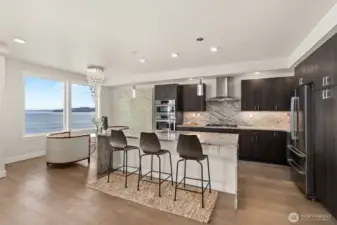 Gorgeous granite bar and backsplash & sleek cabinetry create a sophisticated look.