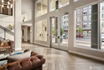 The lobby is seasonally decorated. and there is a call box for your guests to contact you.   The mail room the right around the corner from the elevator (there are 3 elevators) and the stairs that you see here lead to the Community room that all guests can use at no charge (rules apply).