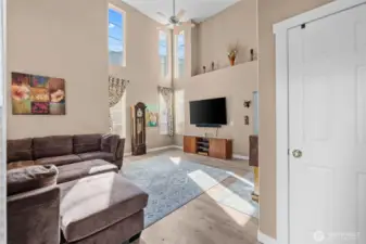 Bright Living Spaces with Soaring Ceilings & New Laminate Flooring