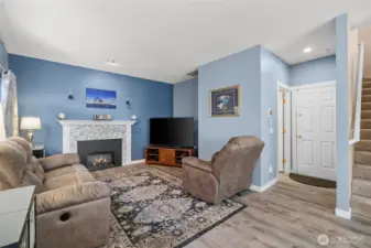 Bright Living Area Featuring a Modern Mantel Upgrade