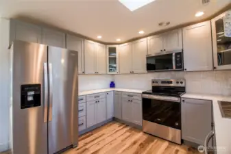 All new Kitchen cabinets, counters and appliances.