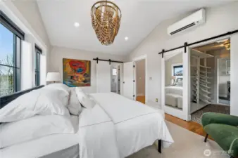 Enjoy a ton of light and AC in the luxurious primary bedroom.
