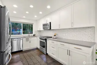Beautiful and bright updated kitchen with quartz counters