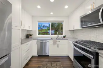 There is a gas stove and stainless appliances