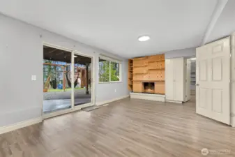 Downstairs bonus room (the fireplace is currently de-commissioned). The slider opens to a large patio and backyard, with direct access to the Railroad trail!