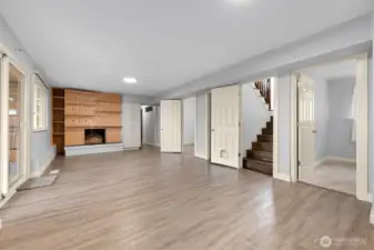 Downstairs bonus room, with 2 bedrooms. At the end of the hall there is a potential ADU that can be closed off with the hallway door