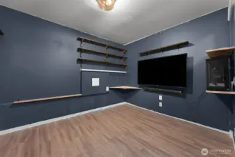 Media room, office, or possible 6th bedroom downstairs, located across from the 3/4 bathroom