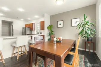 So functional! The dining area connects seamlessly to the kitchen with bar seating in between.