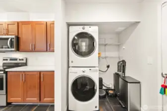 Laundry/utility area between kitchen and garage.