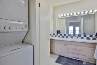 Double sinks and laundry just off the primary bedroom.