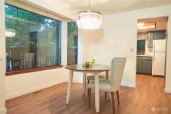 Dining room enjoys the bay window.