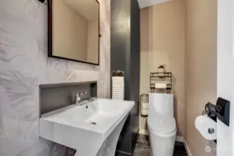 Powder room is located on main floor by the den