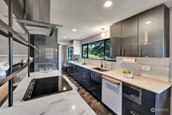 Kitchen has marble counters and tiled floor, top of the line GE Cafe series SMART appliances, slide out drawer cabinet system, built-in wine cooler & under the sink filter system